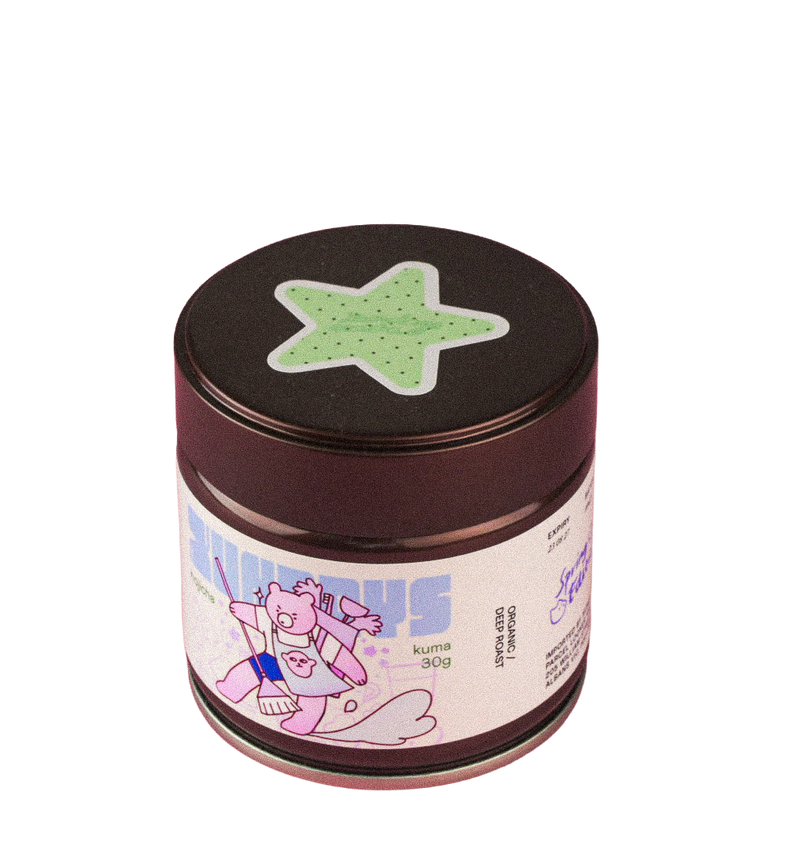 Kuma Dark Roast Hojicha tin by xundays with a mint star lid and illustrated label